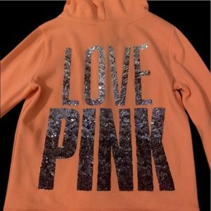 Pink hoodie kind of an orangish color